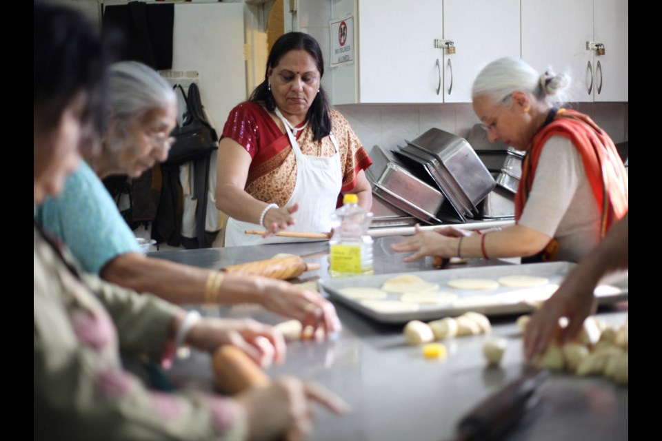 Goddess of goodness: Members of a local Bengali heritage group gather at a Hindu temple in Burnaby to celebrate the Durga Puja festival. Every year, the people of Bengal, India, celebrate with the five-day festival, which honours Ma Durga, the goddess of strength, power and wisdom.