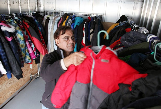 Amjad Sayed loading coats onto the truck for the Rotary Coats for Kids campaign.