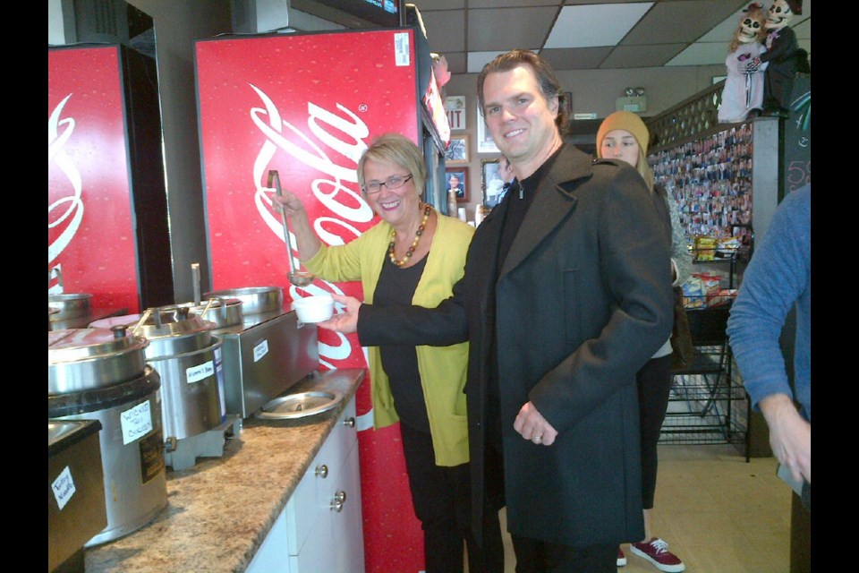 Lending a hand: New Westminster-Coquitlam MP Fin Donnelly and New Westminster MLA Judy Darcy dished out soup at Greens and Beans deli on Saturday. The local restaurant held an event to raise funds for the Columbia Street businesses impacted by the Oct. 10 fire.