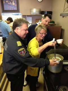 Dishing it out: New Westminster MLA Judy Darcy dishes out soup, with assistance from Matt Green of Greens and Beans Deli and Fire Chief Tim Armstrong, left. Greens and Beans held a fundraiser Oct. 19 to raise money to help downtown businesses impacted by the Oct. 10 fire on Columbia Street.