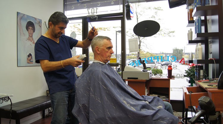 Graeme Wood/Special to the News Leo Silvo cleans up long-time regular customer Steve Plummer who comes from Steveston to Silvo’s LA Clippers at Richlea Centre.