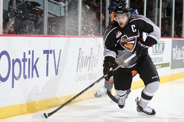 North Vancouver's Dalton Thrower heads up ice for the Vancouver Giants in their 5-1 win over Kamloops Friday night at Pacific Coliseum. Thrower and his family have faced a lot of challenges in recent years but now he's happy to be home after a trade from Saskatoon.