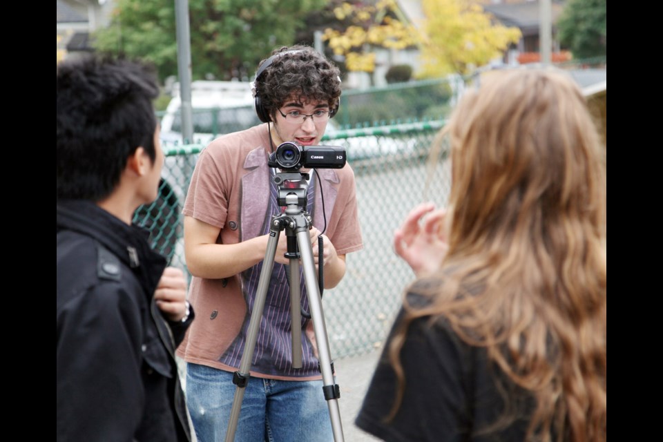 Eye on the job: Phelan Glenn films a scene during a video-making workshop at Lord Kelvin School Oct. 20. The workshop led by ReelYouth was part of the United Way's Care to Change video competition.