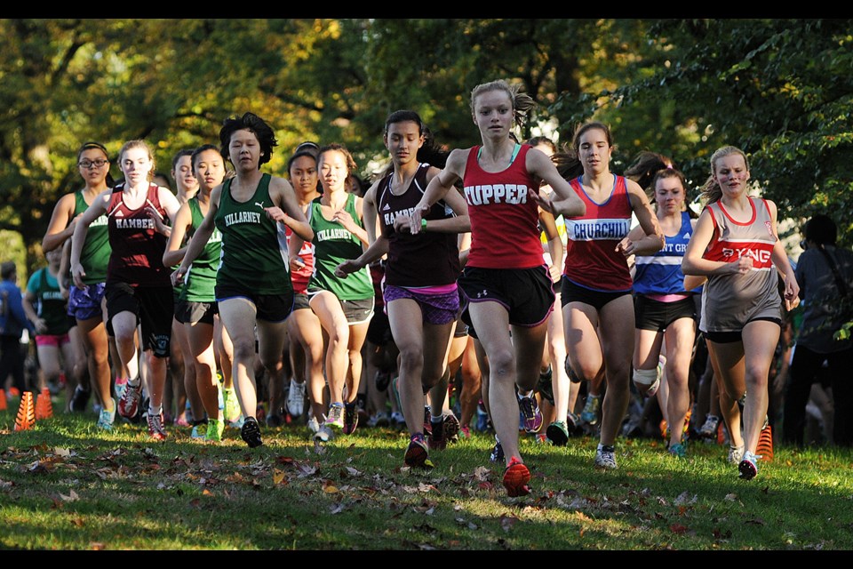 Girls take off from the start line of the Vancouver cross-country final Oct. 23 at Fraserview Park. The winner, Callie Charlton, is on the right edge of the pack in a Lord Byng jersey.