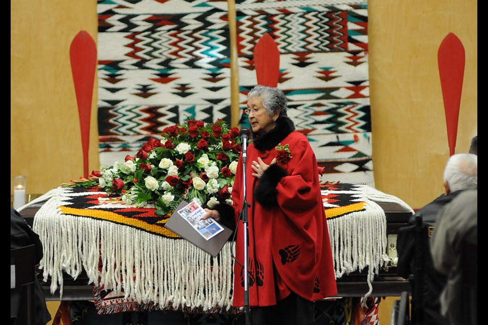 Elder Mary Charles honours former Musqueam chief Ernie Campbell during a funeral service Wednesday morning. Photo Dan Toulgoet