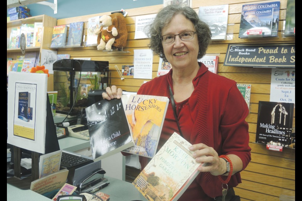 Yvonne Robertson/Richmond News Helen Johnson at Black Bond Books holds up some titles by self-publishers to be featured at the Raindance Festival next week in Lansdowne Centre.