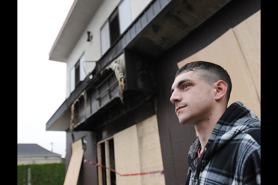 Lev Jackson, the World Boxing Council Canadian featherweight champion, stands outside the Eastside Boxing Club, which is now closed due to a fire. photo Dan Toulgoet