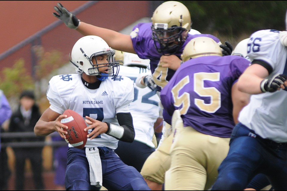 Notre Dame quarterback Theodore Landers (No. 7) holds his focus under pressure from Vancouver College in the 57th playing of the Archbishops' Trophy Nov. 1 at O'Hagan Field.