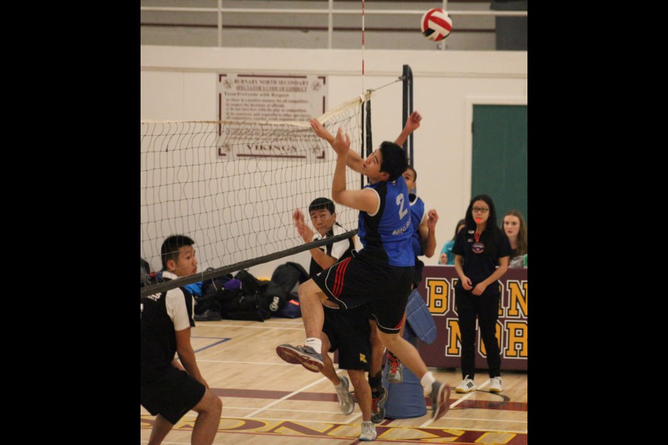 11-04-2013 Moscrop (blue) vs. Burnaby South in highschool volleyball semifinals at Burnaby North. Photo: Jason Lang