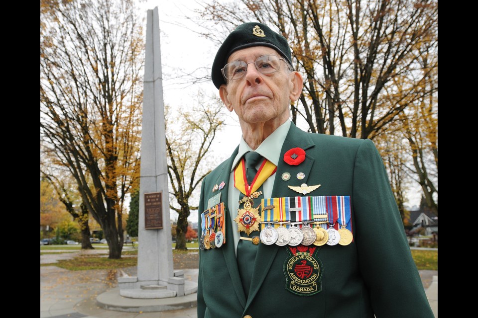 Korean War Veteran Bill Newton, 83, at the cenotaph at Grandview Park. photo Dan Toulgoet