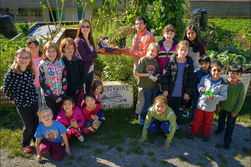 Growing partnership: Students in Forest Grove Elementary’s gardening program are contributing garlic and oregano to a neighbourhood pizza restaurant.