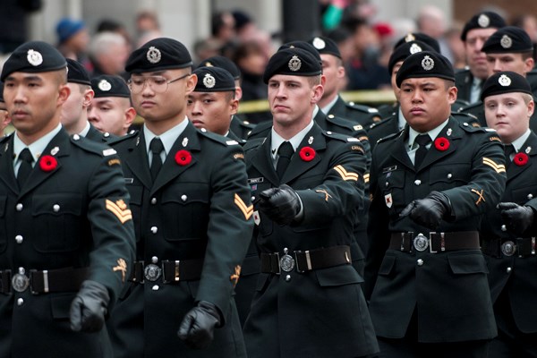 The parade made up of veterans, flag parties, bands, the RCMP, the VPD, and cadet units makes its way down Cambie St. photo Jennifer Gauthier