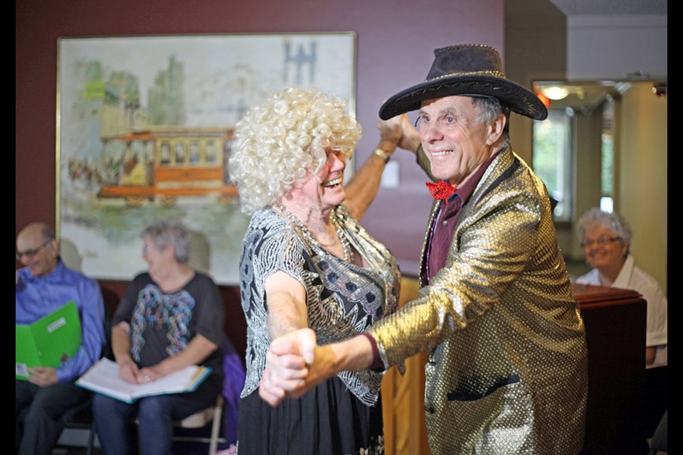From left, Bill Hay (in drag) and Bob Costello practising their moves for Cinderella of the Golden Years, a play written by Burnaby resident Amy Shah, which is showing this weekend at Confederation Seniors Centre.