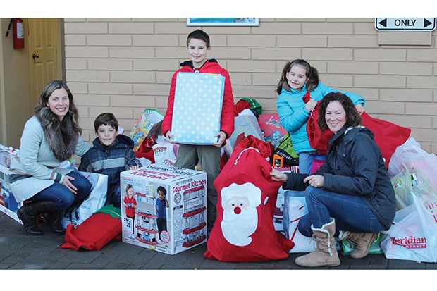 The Stocking For Kids program wrapped up a very successful 17th season this week when over 400 stockings were delivered to Deltassist for distribution. Sonja White (left) and Tiffinie Hammerer (along with their children) adopted 200 stockings in the program organized by Tsawwassen Town Centre Mall and co-sponsored by the Delta Optimist. The local moms distribute the stockings among their friends and family. All the stockings were loaded into two vans, as well as an overflowing trailer, Wednesday morning and delivered by the Century Group maintenance team.