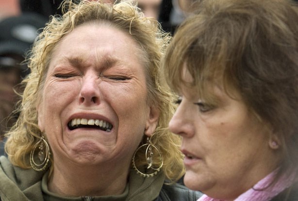 Karin Joesbury, left, cries outside the courthouse in New Westminster, British Columbia December 9, 2007, after the guilty verdict for serial killer Robert Pickton. Remains of Joesbury's daughter Andrea were found on the Pickton farm.