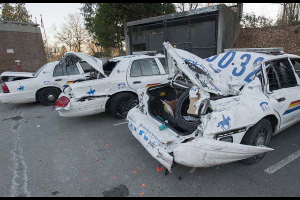 These RCMP cruisers were hit during rampage.