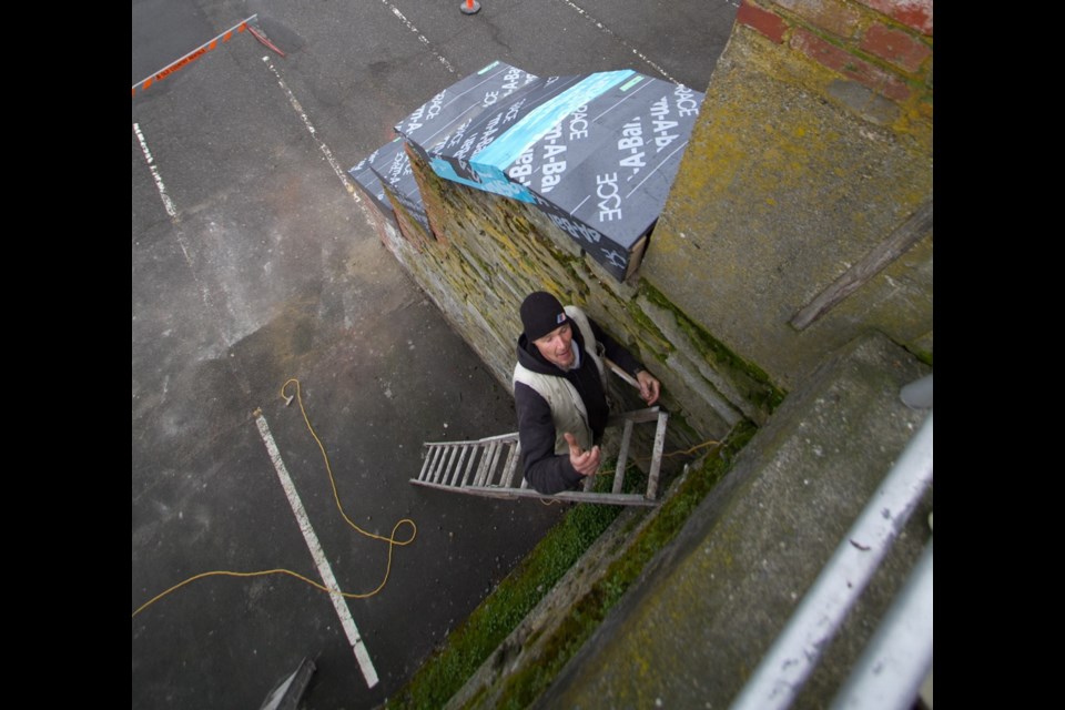 Thursday: Keith Walsh looks into a crack that shows a tunnel in a wall on Wharf Street.