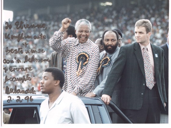 North Vancouver resident Etienne van Eck stands guard as Nelson Mandela enters a stadium to cheering crowds. The former bodyguard has gone back to South Africa to mourn the former president's death.