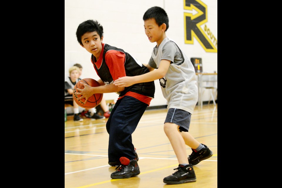South Burnaby Metro Club under-11 boys basketball Dragons (black) vs Pistons (white)