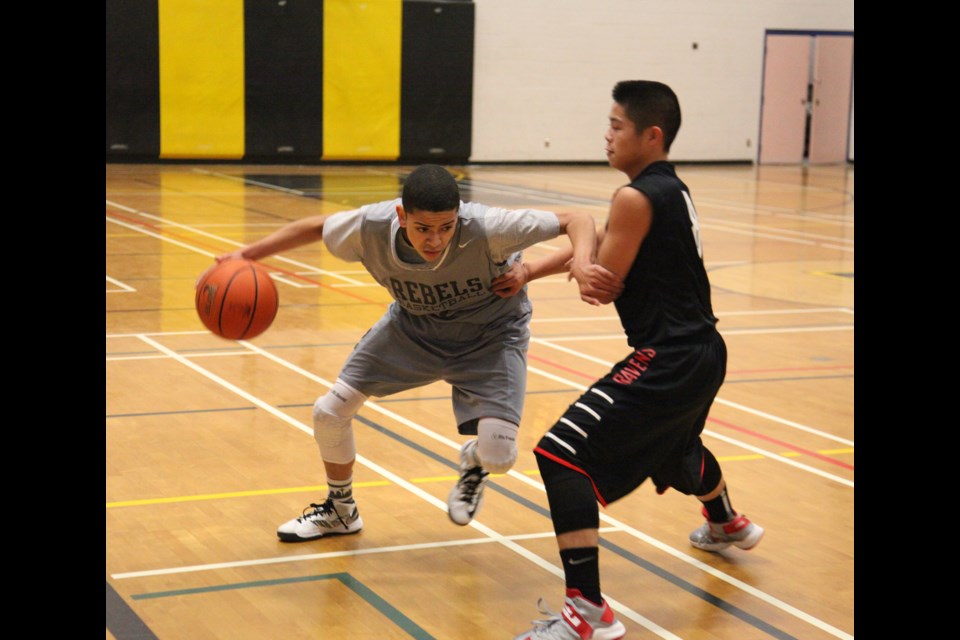 12-19-2013 Burnaby South (grey) vs. Terry Fox in seniors boys basketball at the Rod Thomson memorial tournament at Burnaby South. Photo: Jason Lang