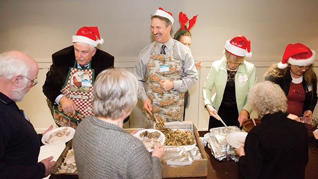 Chief Jim Cessford and Deputy Chief Lyle Beaudoin helped serve turkey and stuffing at the Ladner Community Kitchen’s fifth annual Christmas Dinner.