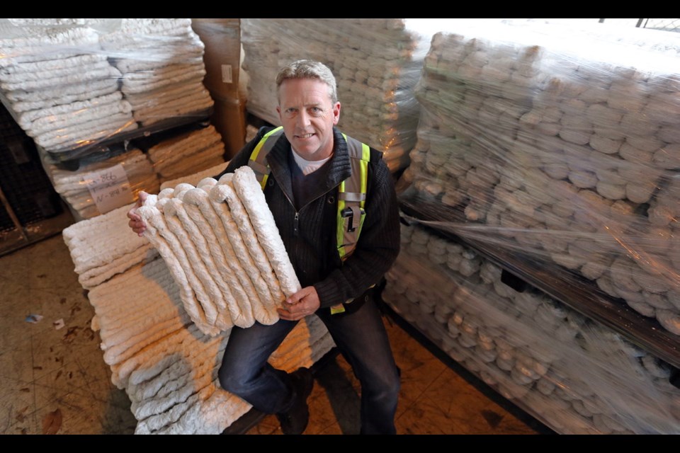 Steve Biles with some of the densified styrofoam produced by the recycling process.