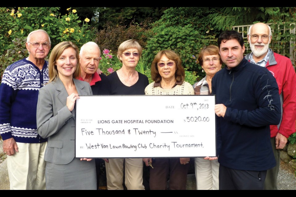 Members of the West Vancouver Lawn Bowling Club join their president Tim Mason in presenting Alexandra Eady of the Lions Gate Hospital Foundation with $5,020 for the nuclear medicine campaign at Lions Gate Hospital; The money was raised on Labour Day weekend at the club’s annual charity day.