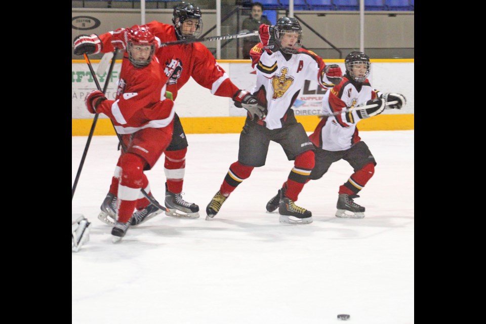 12-29-2013 New West C1 (white) vs Ridge Meadows at the Herb House hockey tournament. Queen's park arena. photo Jason Lang