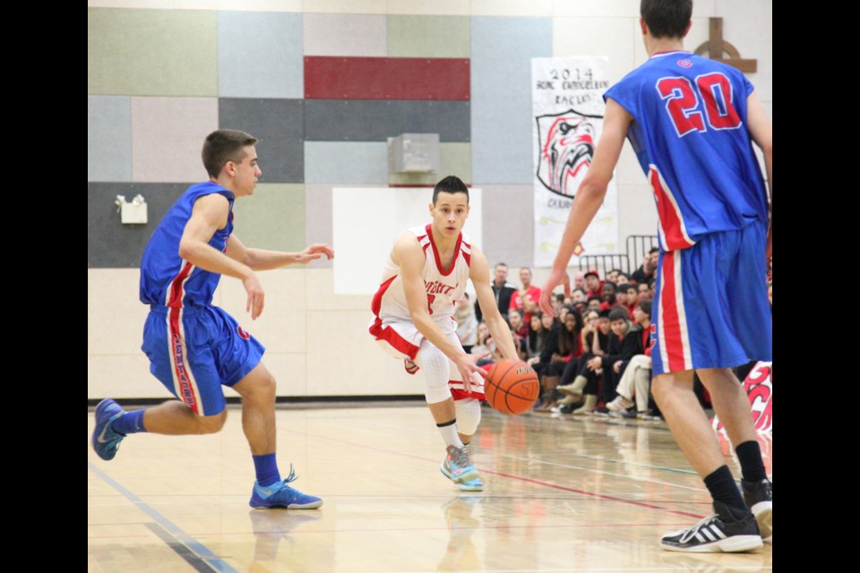 01-08-2014 St. Thomas More (white) vs. Centennial in the opening game of the Chancellor High School boys basketball tournament at STM.
photo Jason Lang