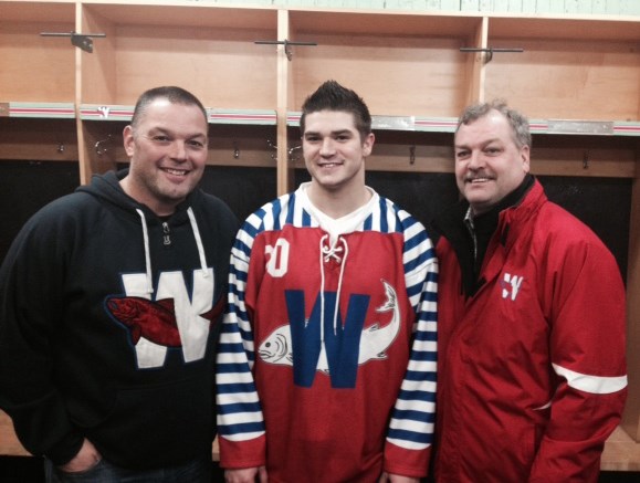 New Westminster assistant general manager Ray Porcellato, left, and GM Jamie Stewart, right, flank their newest defensive signing, Jesse Gillespie.