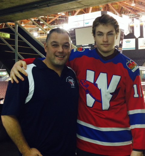 New Westminster assistant general manager Ray Porcellato, left, shows off the junior A club's newest Salmonbellie, Maxwell James from Kamloops.