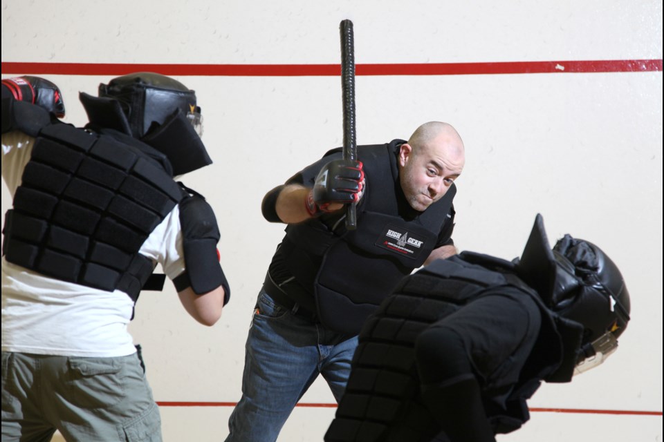 Friendly faceoff: Dan Rheaume, centre, takes on other members of the Heisei Budo self-defence group at a recent drop-in at SFU.