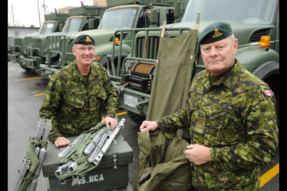 Members of 15th Field Artillery including Honorary Lt.-Col. William Rodgers (L) and Honorary Col. Grant Smith are preparing for a massive earthquake drill. photo Dan Toulgoet