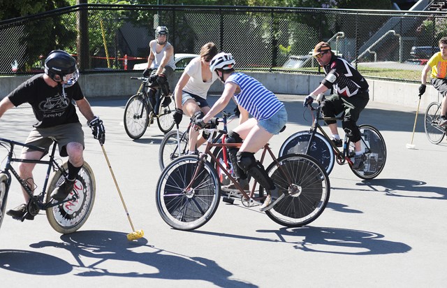 Members of the East Van Bike Polo Club play on the world’s first custom-built bike polo court, which measures 38 by 20 metres, in Grandview Park on Commercial Drive. Photo: Dan Toulgoet.