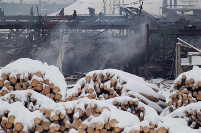 Smoke rises from the Babine Forest Products mill in Burns Lake, B.C. Sunday, Jan. 22, 2012. THE CANADIAN PRESS/Jonathan Hayward
