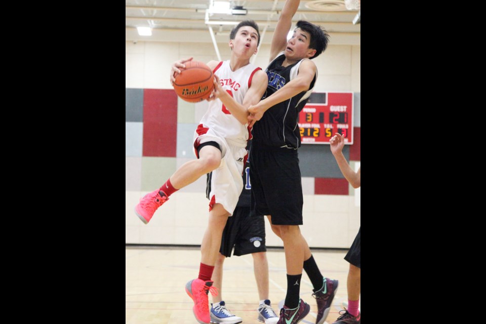 01-02-2014 STMC (white) vs. McMath, junior varsity high school basketball. photo Jason Lang