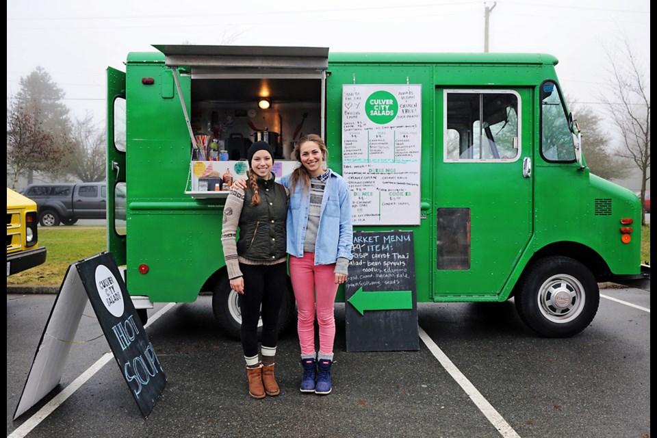 Culver City Salads owner Christina Culver was in Hawaii to celebrate her 30th birthday this past Saturday so she left her food truck in the capable hands of sister Sarah Culver, right, with Una Trevillion for the January Food Truck Festival at Nat Bailey Stadium. This Saturday is the last day of the festival. Photo by: Rebecca Blissett