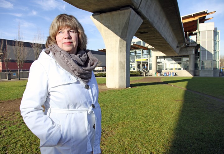 Destined to change: Bev Grieve, the city's director of development services, stands at the Braid SkyTrain station that's within the Sapperton Green area. New Westminster city council will consider an amendment to the official community plan for the site later this month.