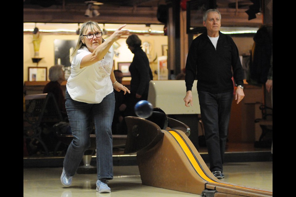 Pat McIntyre lets one fly down the alley at Commodore Lanes. She and fellow members of the Golden Age League relocated to the downtown bowling alley after the Varsity Ridge was demolished. Photo Dan Toulgoet