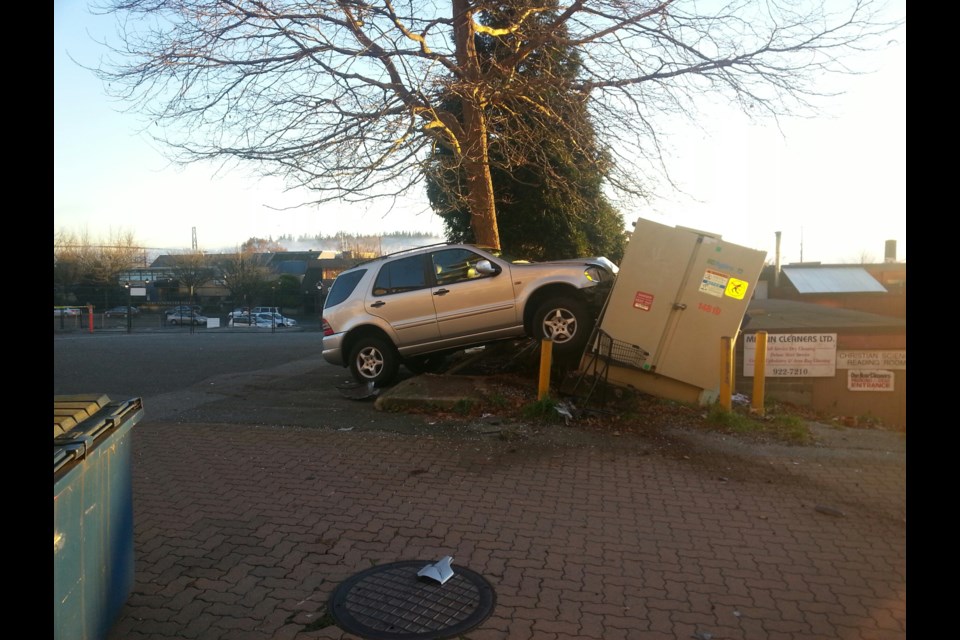 The scene of an accident in Ambleside. Police say it appears a 92-year-old woman accidentally hit the gas in the parking lot and crashed into a BC Hydro substation, knocking out power to the neighbourhoodl=.