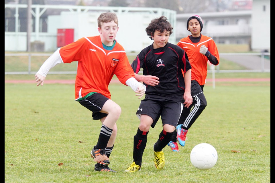 01-18-2014 Cliff Avenue United Golovetsky (orange) vs North Vancouver Nitro at Confederation Park
Photo: Lisa King