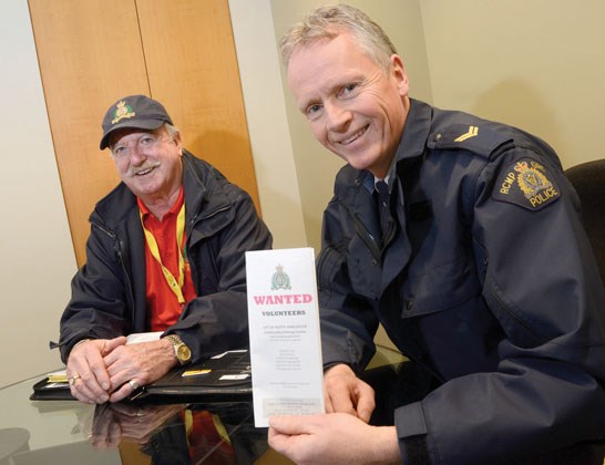Community policing volunteer Doug Gavin and Cpl. Richard De Jong, North Vancouver RCMP spokesman.