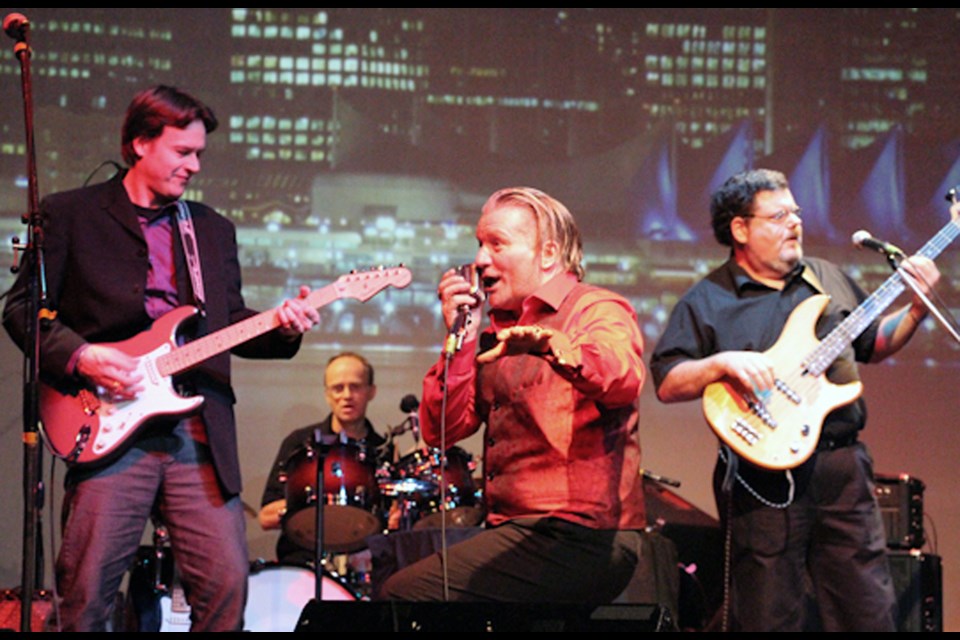 The Mojo Stars, featuring (from left) Mark Rankin on lead guitar, James Badger on drums, Randy Clarke on vocals, and Rob Marr on bass, perform during a fundraising show at the Columbia Theatre in support of Variety - The Children's Charity.