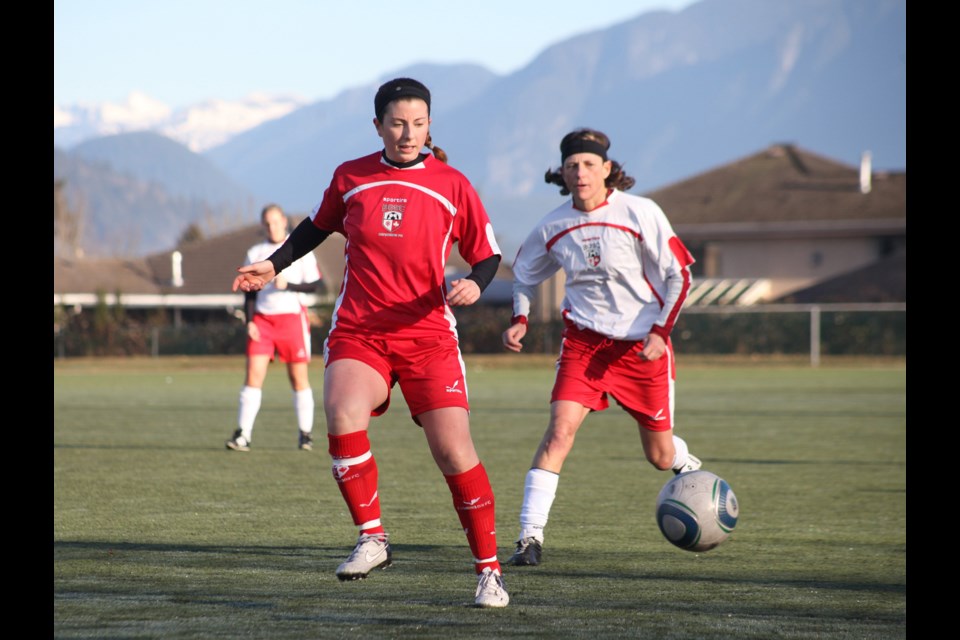 01-26-2014 Burnaby Selects (red) vs. Burnaby FC in west coast women's select A cup play at Cariboo Oval. Photo: Jason Lang