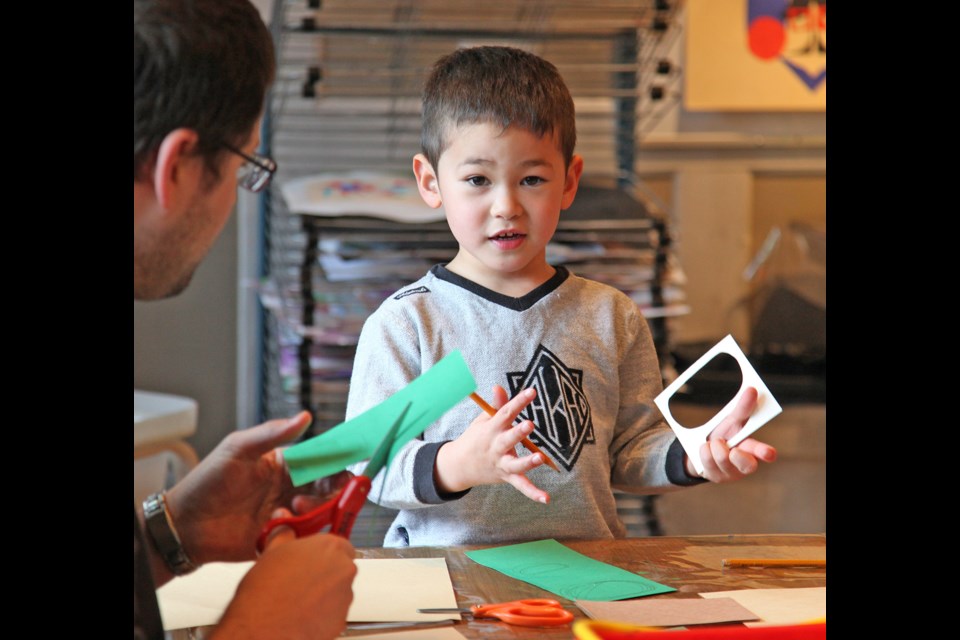 Jayden Parr-Pearson tries his hand at making Inuit and First Nations style art at the Burnaby Art Gallery during the In the BAG family program.