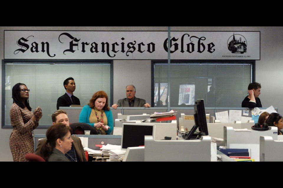 Extras portray staff of the fictional San Francisco Globe get ready for the cameras to roll at the Times Colonist Monday during shooting of the TV series Gracepoint.