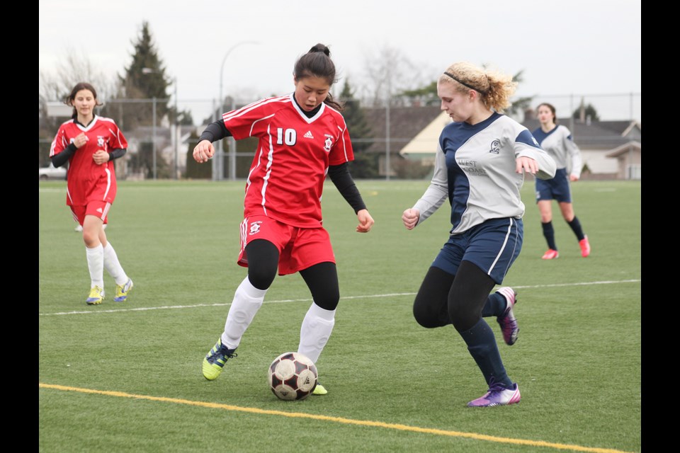 02-02-2014 Burnaby Girls (red) vs. WCAG Panthers, u14 soccer at Byrne Creek Oval.
photo Jason Lang