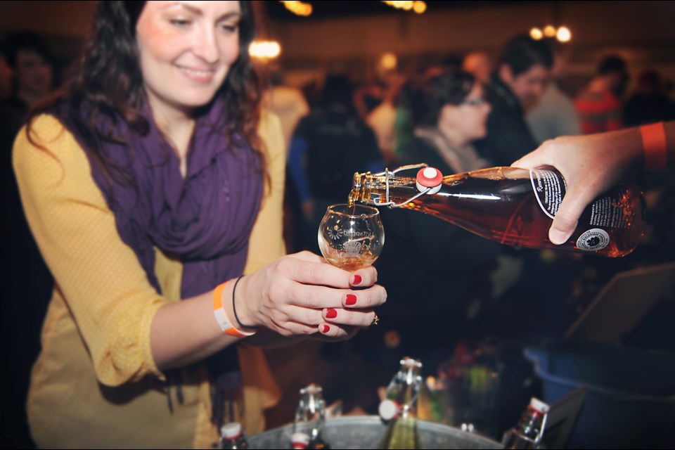 CAMRA Vancouver events coordinator Amanda Barry is served some cider from Sea Cider Farm and Ciderhouse during Saturday’s CiderWISE at the WISE hall. The cider and gluten-free beer tasting event is the first of its kind in Vancouver and CAMRA hopes to make it an annual event. Photo by: Rebecca Blissett