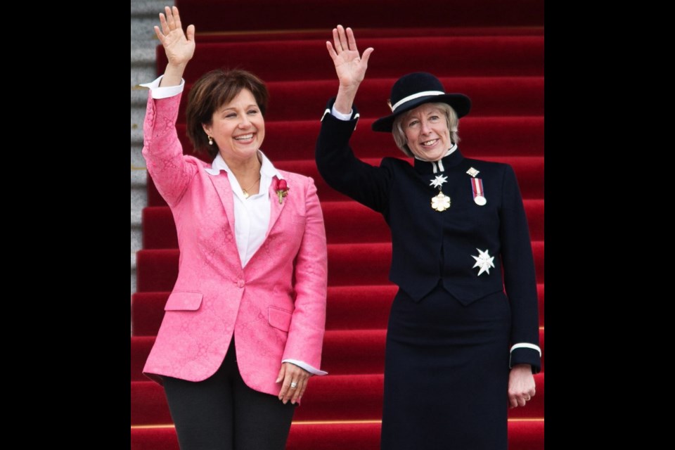 Premier Christy Clark and Lt.-Gov. Judith Guichon wave to the crowd from the legislature steps prior to the throne speech on Tuesday.