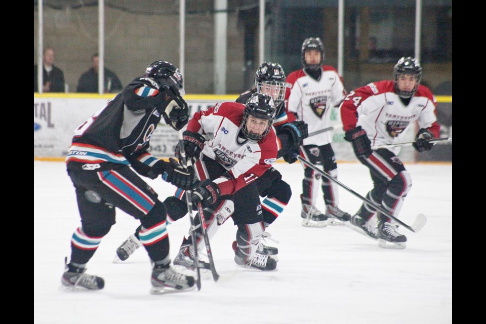 02-09-2014 Northwest Giants (white) vs. Okanagan Rockets photo Jason Lang